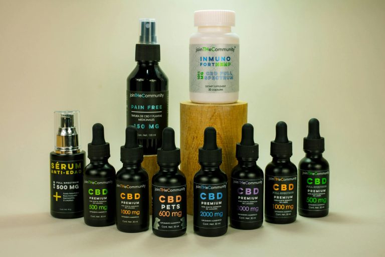 Various CBD products including serums and capsules on a white background, ideal for wellness and health.
